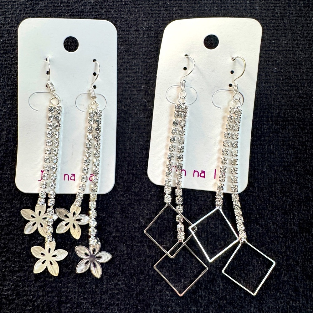 Set of two silver tone with clear faux gems dangling earrings